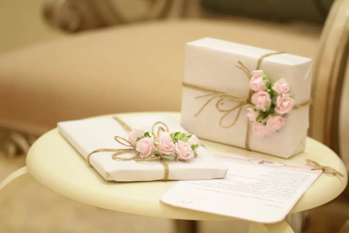 Gifts wrapped up next to a handwritten letter