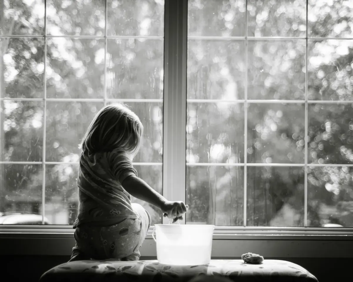 Girl cleaning windows