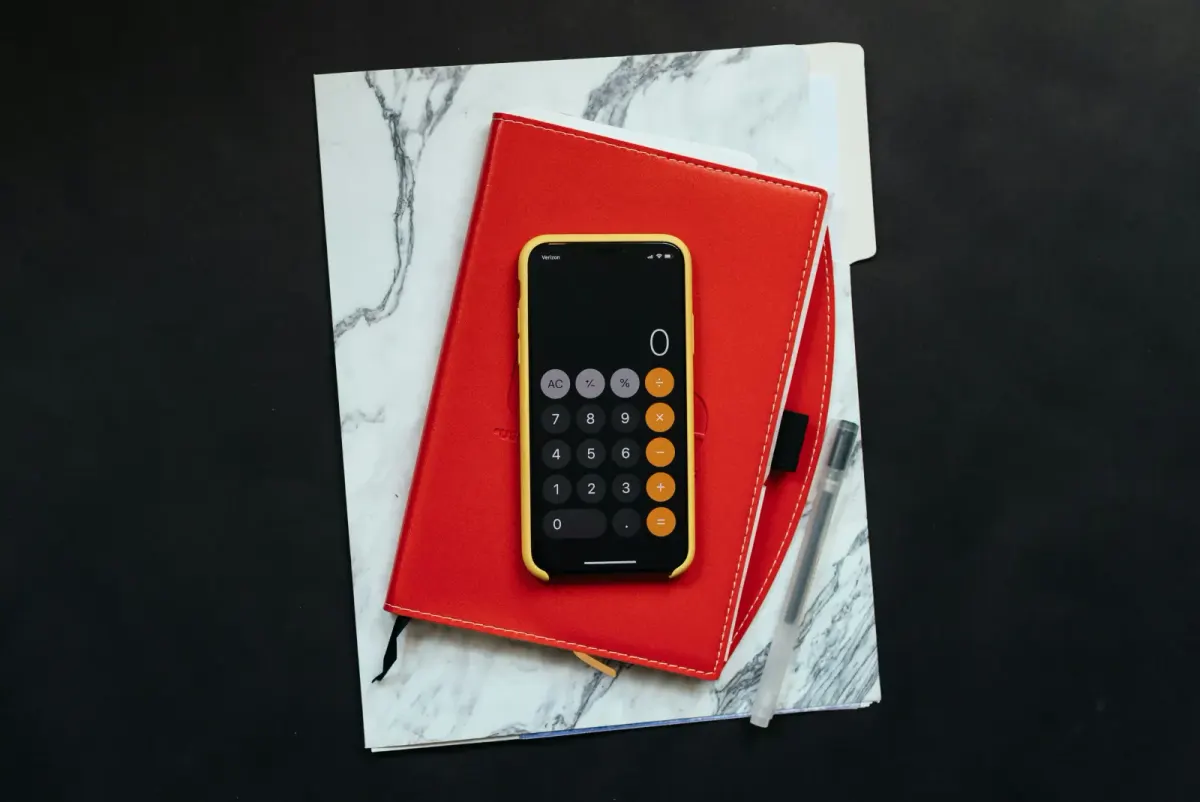 Book and calculator over a table