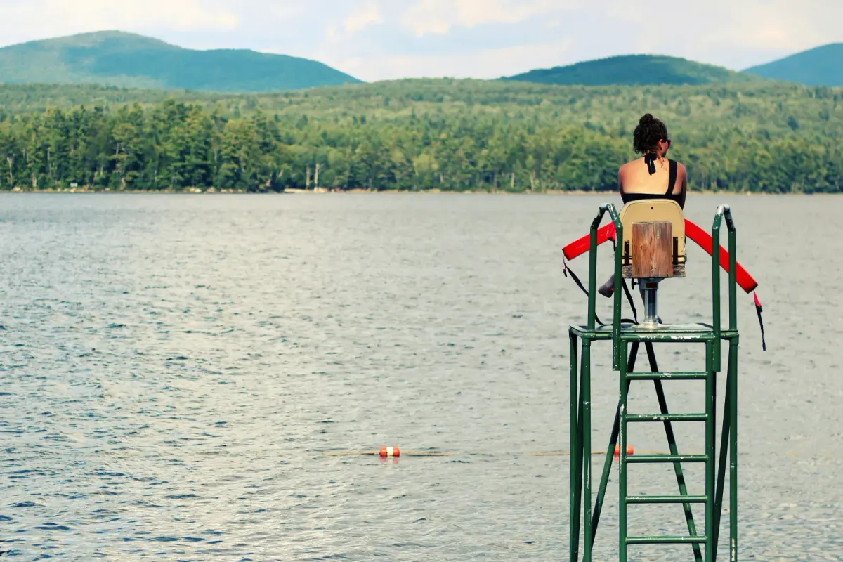 Girl lifeguarding at a lake
