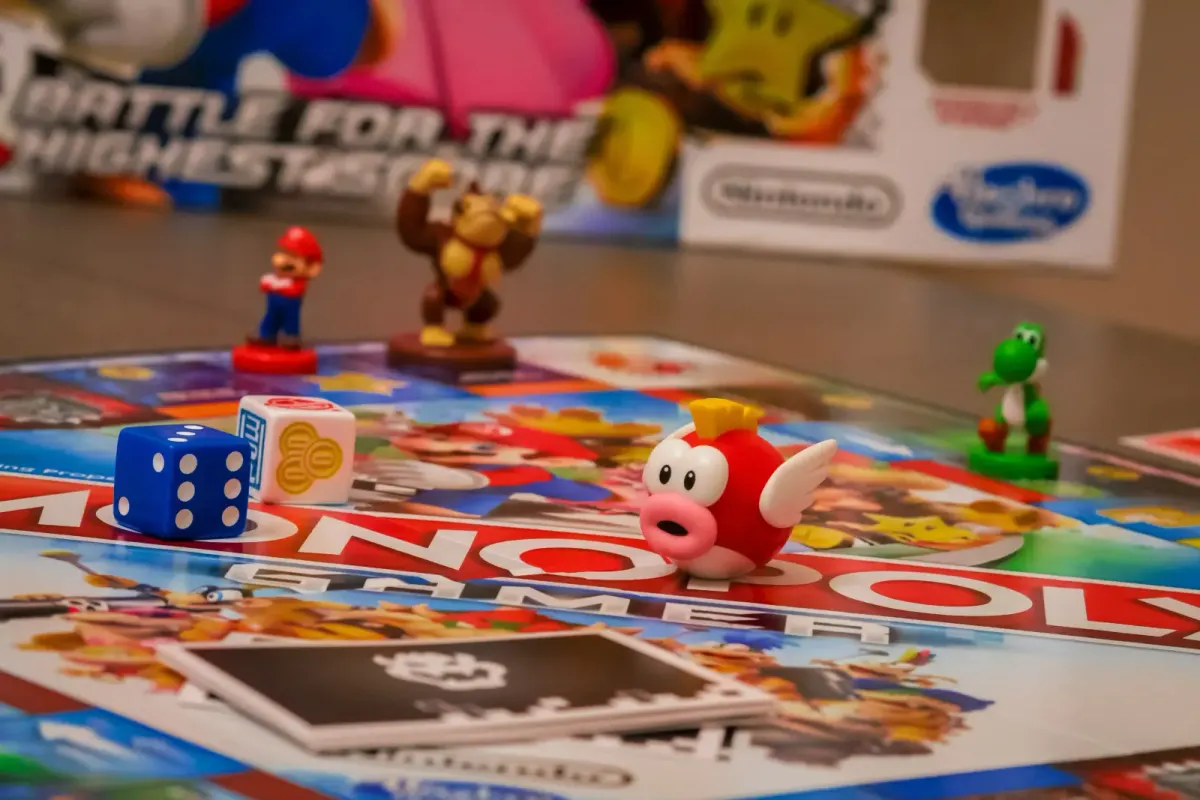 Nintendo-themed Monopoly board with Mario character figurines and dice
