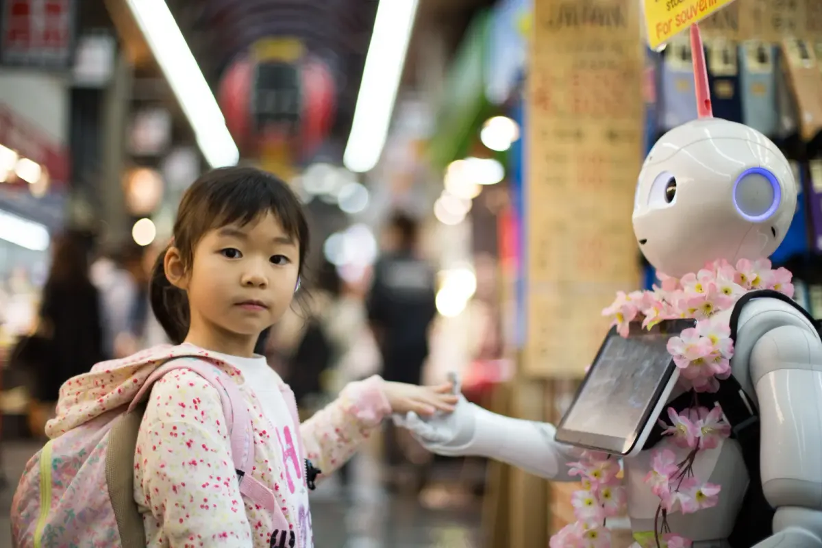  Kid holding hands with Chinese robot