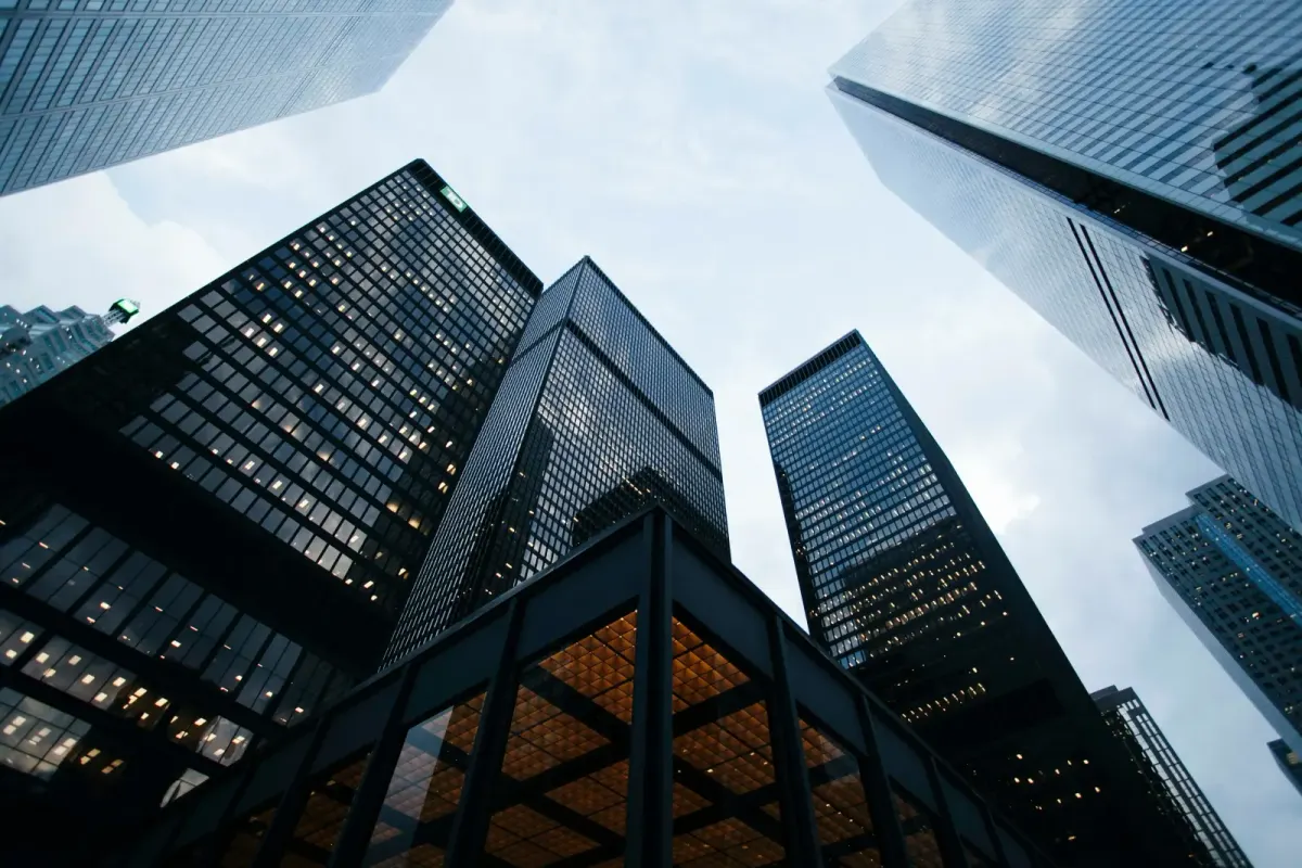 Looking up at towering downtown skyscrapers against the sky