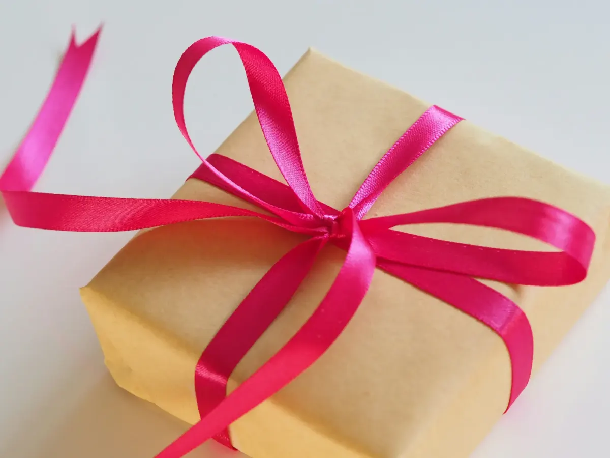 Gift tied with red ribbons